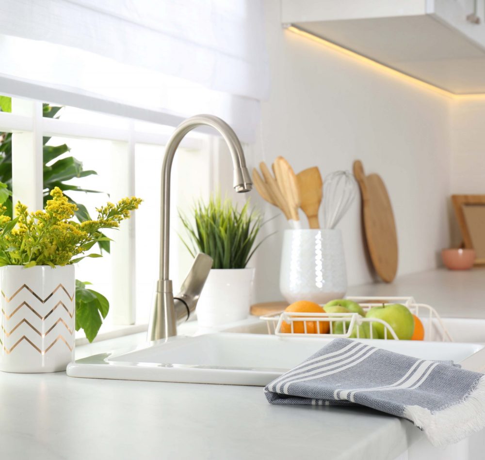 Beautiful white sink near window in modern kitchen